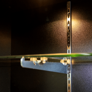 Black 78-inch wall case display with glass sliding doors, push lock, five adjustable 12-inch shelves, LED down-lights, and a matching back panel.